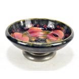 WILLIAM MOORCROFT LIBERTY & CO; a 'Pomegranate' pattern pedestal bowl, on Tudric pewter base,