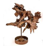 LISA CULLEY; a large tree root mounted on metal cart wheel, signed with artist's plaque, height 82.