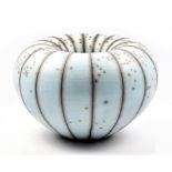 TIM ANDREWS (born 1960); a large raku humbug form, burnished and smoke fired duck egg blue