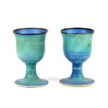 ABDO NAG1 (1941-2001); a pair of stoneware goblets covered in turquoise glaze with bronze rims,