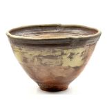 ROBIN WELCH (1936-2019); a large deep conical stoneware bowl, impressed RW mark, diameter 42.5cm. (
