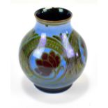 WILLIAM S MYCOCK FOR ROYAL LANCASTRIAN; a small globular lustre glazed vase featuring floral scrolls