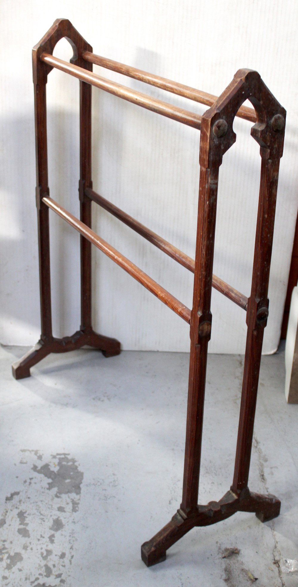 A Victorian pine towel rail with Gothic-style carving, height 91cm.