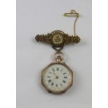 A 9ct gold ladies' open face pocket watch with gilt embellished white dial and Roman numeral time