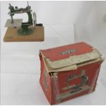 A vintage E L Grain children's sewing machine, fitted in original box.