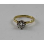 A yellow metal ring set with solitaire diamond, approx one carat, size N 1/2.