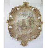 A 19th century ornate pottery wall plaque the centre depicting Haddon Hall, Derbyshire,