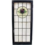 A leaded and glazed window with rose motif, in painted wooden frame, 111 x 49cm.