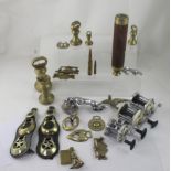 A mixed lot containing brass bell weights, telescope, three sea fishing reels, Jaguar car mascots,