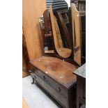 A mid-20th century triple mirror back dressing table, three frieze drawers over one lower drawer,