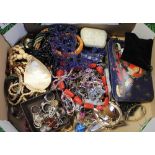 A large quantity of costume jewellery to include rings, necklaces, brooches etc.