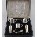 An Edward VIII hallmarked silver Art Deco five-piece condiment set, each of angular form,