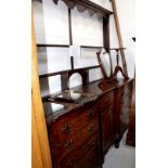 An 18th century oak inverted break-front dresser base with harlequin plate rack top and adapted top