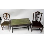 A reproduction mahogany veneered dropleaf coffee table with green leather inset panels,
