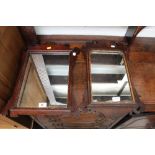 Two 19th century mahogany-framed Chippendale-style wall mirrors, largest example 51 x 39cm (2).