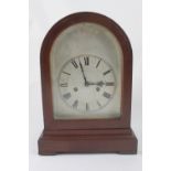 A late 19th century German mahogany dome top mantel clock,