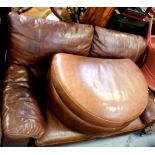 A brown leather two-seat sofa with matching demilune foot rest (2).