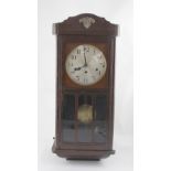 A mid-20th century oak-cased wall clock and two further wall clocks (3).