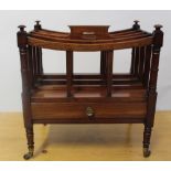 A 19th century mahogany Canterbury with single base drawer, raised on brass casters, height 50cm.