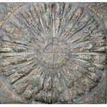 A 20th century carved wooden architectural wall plaque depicting a four-sectional stylised sunburst
