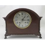 An Edwardian mahogany mantel clock by Peters, Liverpool, the silvered dial with Roman numerals,