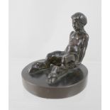 A small bronze figure of a seated satyr on circular base, unmarked, height 7cm.