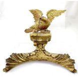 A Georgian carved gilt wood picture surmount depicting a Federal-style eagle on rocks, height 50cm.