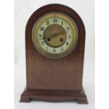 A Victorian inlaid mahogany mantel clock, the enamel chapter ring set with Roman numerals,
