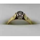 An 18ct yellow gold illusion-set diamond solitaire ring, size M, approx 2.9g.