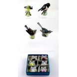 A boxed set of six Coalport porcelain floral table card holders and four Beswick birds including