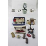 Various items to include a Parker pen set, pen knives, dice, lighters including novelty examples,