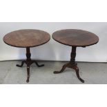 Two 19th century oak circular-topped tripod tables (2).