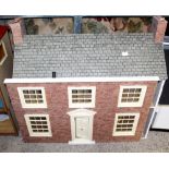 Three modern dolls' houses to include a Georgian farmhouse style example,