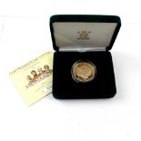 A 2001 gold proof crown in 'The Royal Mint Presentation Pack', numbered 029, boxed.