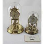 Two German Kieninger & Obergfell brass anniversary clocks with chased brass dial marked Kundo,