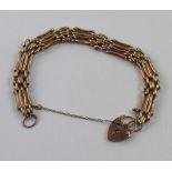 A 9ct gold gate link bracelet with padlock clasp, approx 17.8g.