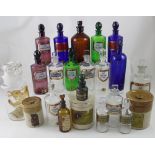 A collection of chemist related items to include twenty-one antique and modern clear and coloured