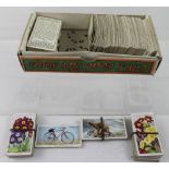 A collection of Wills and John Player cigarette cards to include cycling, animals, flowers,