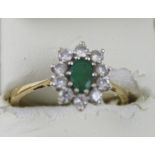 An 18ct yellow gold diamond and emerald dress ring, size Q, approx 3.7g.