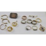 A collection of gold and silver jewellery to include two 9ct gold rings, 9ct gold coin mounts,