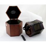 A Lachenal & Co concertina with pierced wooden ends, thirty-one bone keys, serial number 195827,