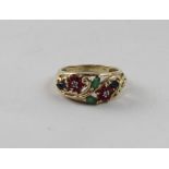 A ladies' 9ct gold ring, the open work flower design inset with multi-coloured stones,