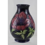 A Moorcroft Anemone blue ground baluster vase.