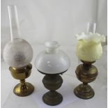 Three 20th century brass oil lamps (part af) (3).