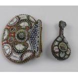 A micro mosaic belt buckle in the form of a shell and mandolin.