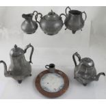 A collection of pewter ware to include coffee pot,