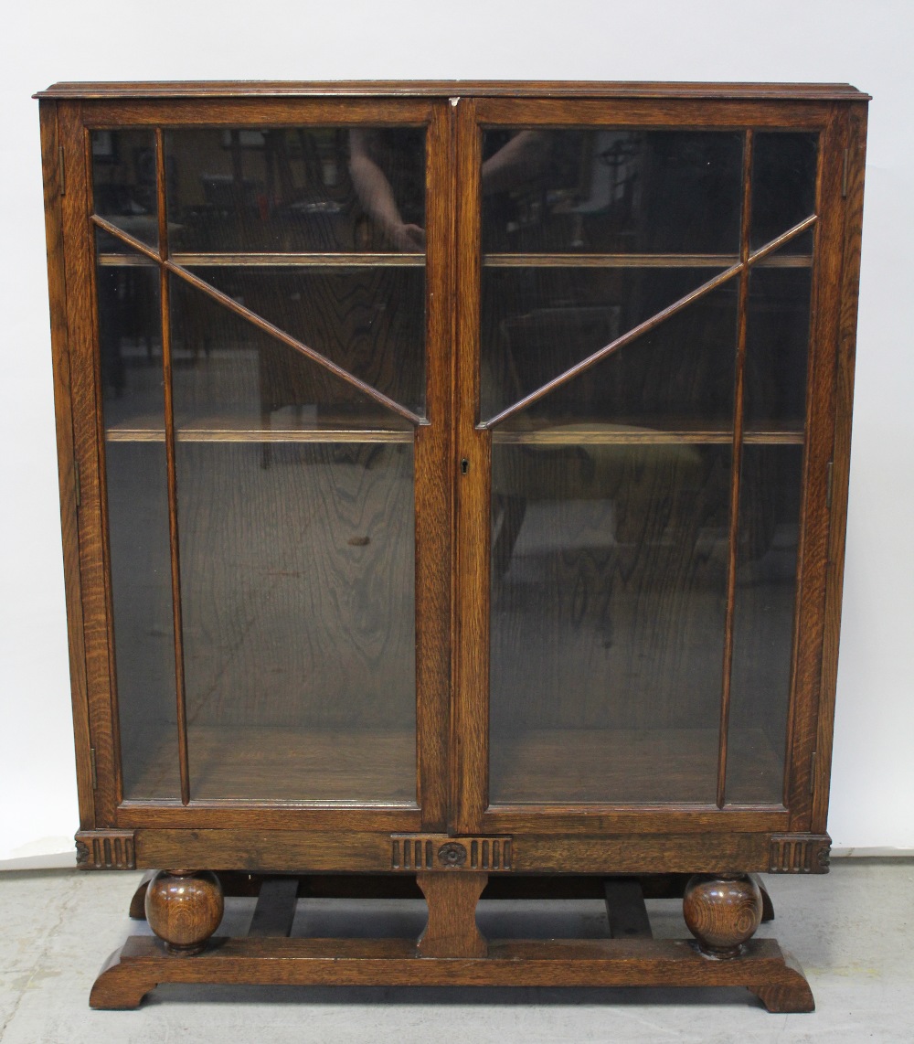 An early 20th century oak-cased twin-door display cabinet, width 92cm.