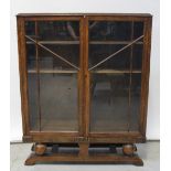 An early 20th century oak-cased twin-door display cabinet, width 92cm.