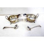 A pair of George VI hallmarked silver sauce boats with piecrust edges,
