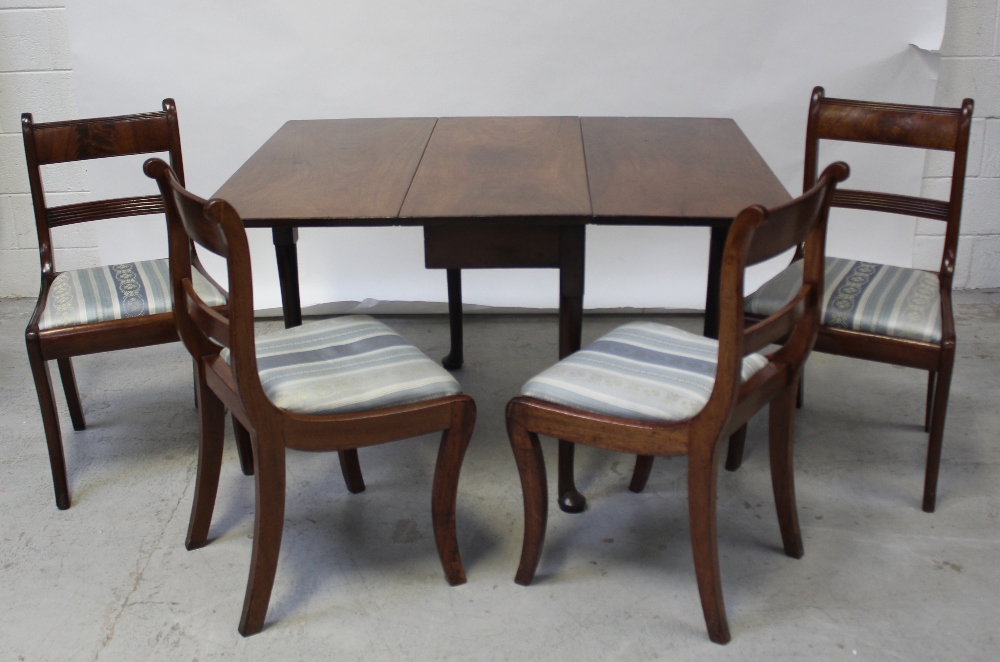 A 19th century mahogany dropleaf supper table on tapering legs with pad feet,